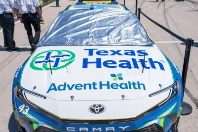 Texas Health and AdventHealth logos displayed on the NASCAR race car
