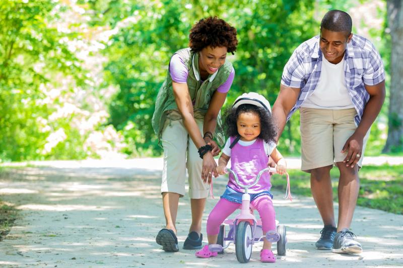 A Family Takes Their Daughter for A Tricycle Ride in Texas