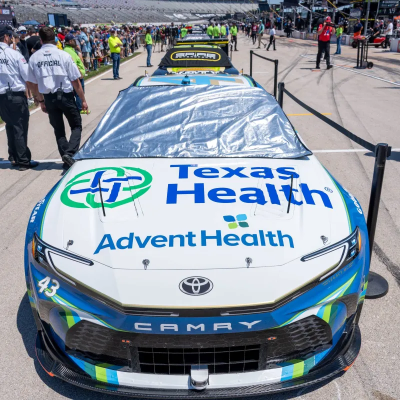 Texas Health and AdventHealth logos displayed on the NASCAR race car