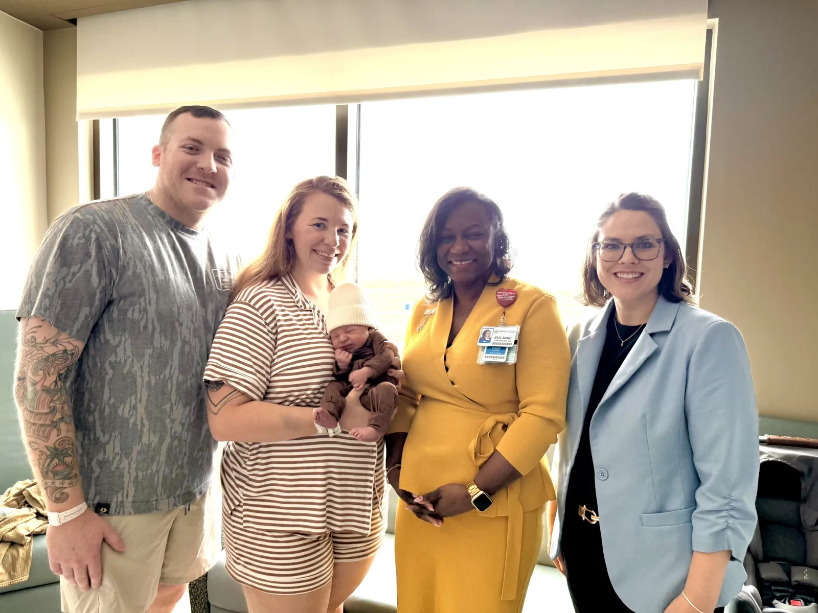 President and CMO of Texas Health Hospital Mansfield standing with the family of an unforgettable birth story