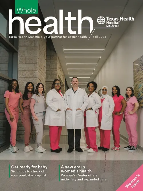 Team of providers, standing in the hospital hallway for a picture
